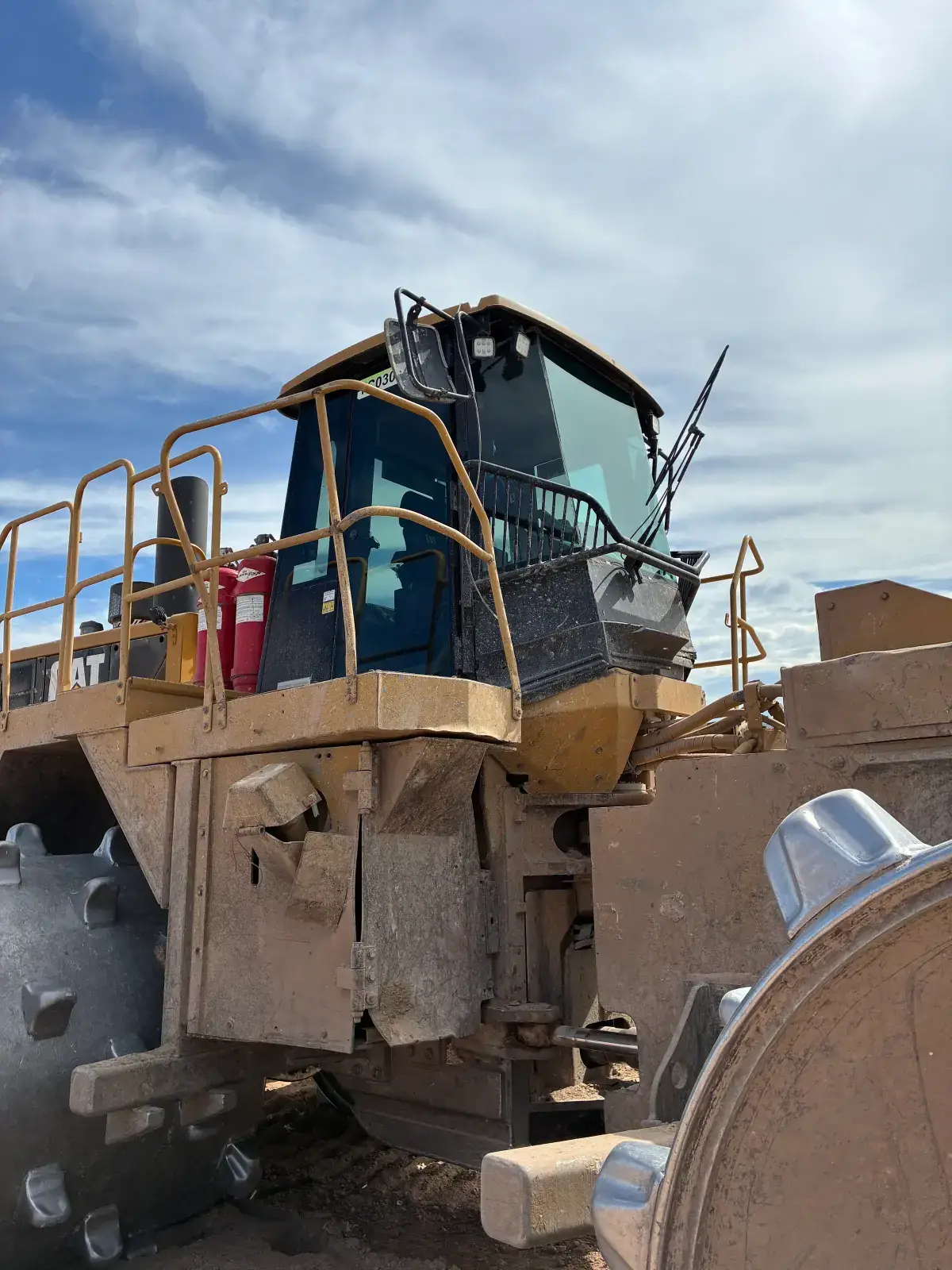 Close view of tinted front and side cab windows on heavy equipment