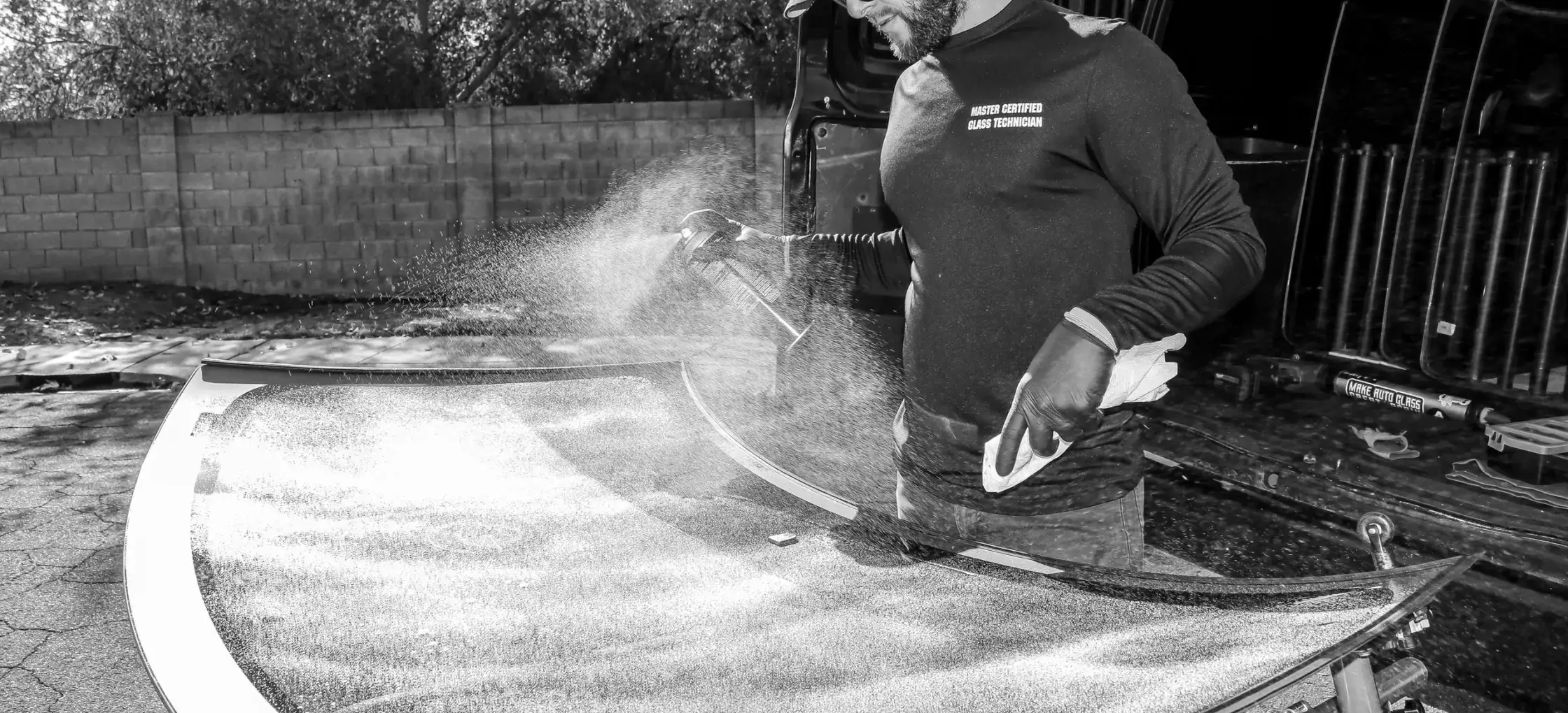 Technician preparing auto glass for installation